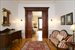 Parlor with pocket doors onto dining room
