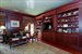 Handsome library / office has views of the gardens and pool