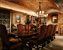 The wine cellar tasting room with fireplace and custom furnitre has a 4,000 bottle capacity 