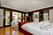 Master bedroom with a view to the pool