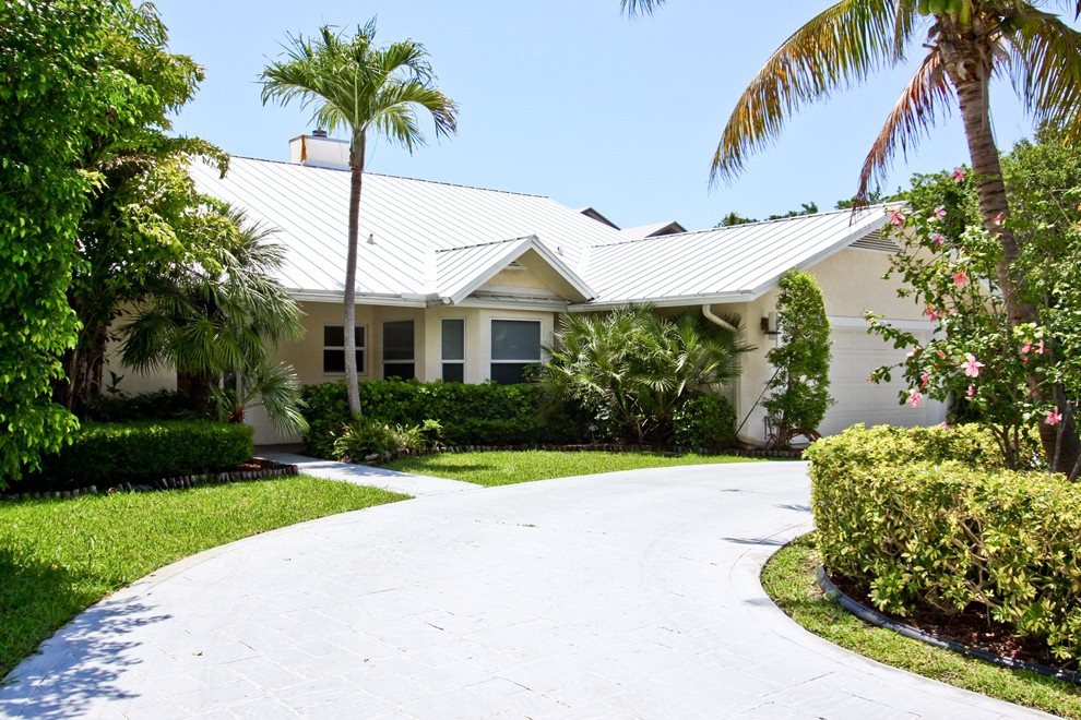 Circular driveway and lush landscaping