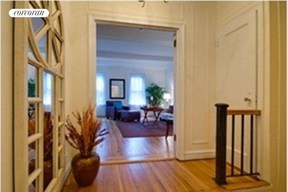 Looking from dining room through foyer into living