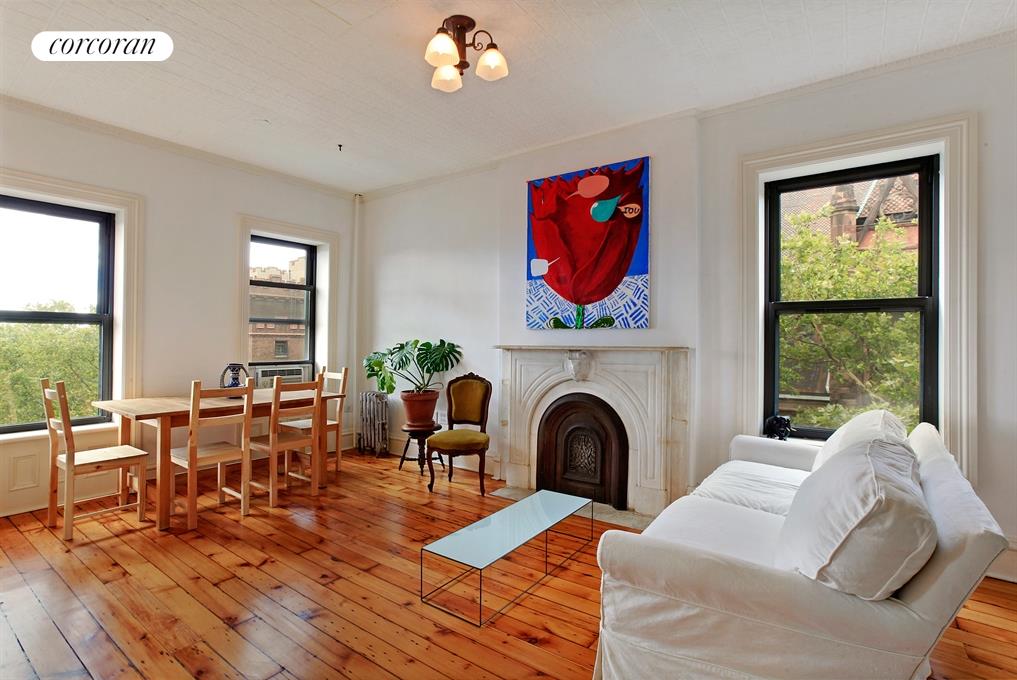 Bright living room with original marble fireplace