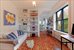 Sunny living area with wide plank pine flooring