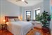 Large master bedroom with sunny bay window