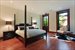 Floor to ceiling windows in a beautiful master bed