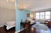 3/4 height wall separates bedroom from living area