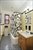 Spacious windowed bathroom w renovated tiled floor