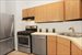 Galley kitchen with stainless appliances