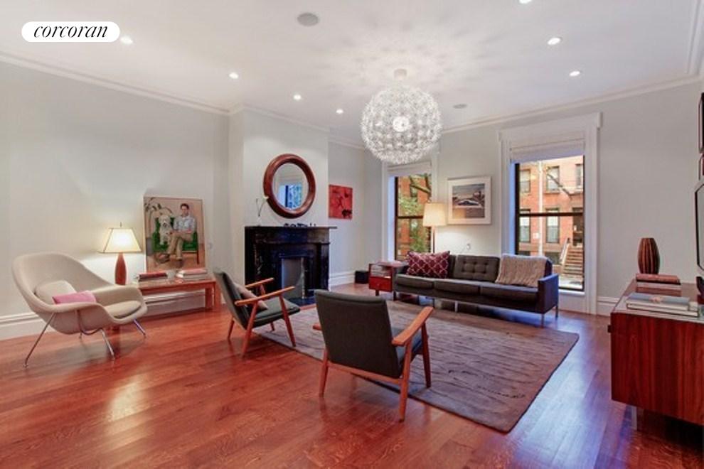 Wide Sunny Living Room with Floor to Ceiling Windo