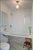 Secondary bath with hand glazed Moroccan tile