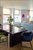 Dining area with access to one of two living room balconies