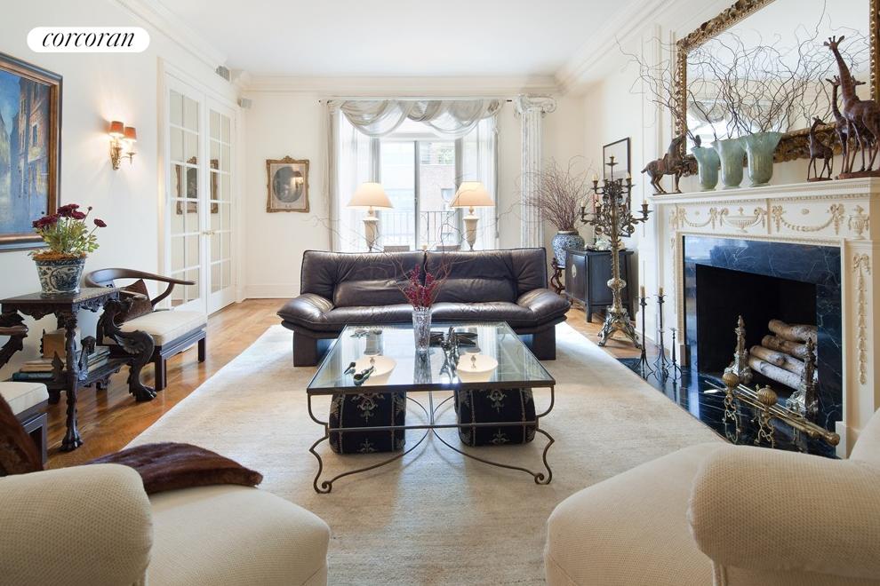 Original herringbone wood floors & juliet balcony.