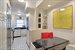 Windowed eat-in kitchen fills with daylight