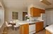 Windowed eat-in kitchen with washer dryer