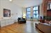 Bright, open living room with nearly 13' ceilings.
