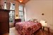 Spacious, airy bedroom with ample closet space.