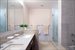 Master bathroom with double sinks and separate tub