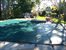 huge free form pool with hot tub