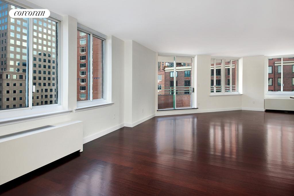 Generously proportioned L-shaped living room with plenty of space for formal dining and separate entertaining area