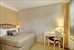 Sleeping area with exposed brick wall, separate AC