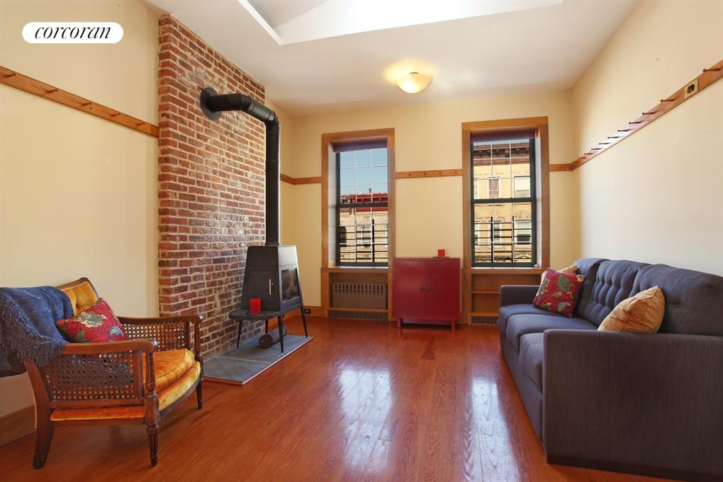 Living Room with skylight and wood-burning stove