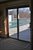 doors from sunroom to deck and pool