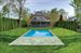 Gracious and expansive back yard with heated gunite pool