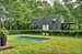 Charming and private landscaped section of over 5 acre property