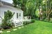 View of yard and deck and side elevation