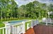 Downstairs master bedroom has deck overlooking pretty back yard