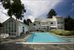 rear exterior and gunite pool with pool house
