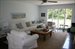 Large living area with doors to the deck