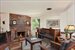 Cozy conversation area with brick wood burning fireplace