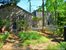 Multilpe sitting areas surrounding herb; vegetable & multl flower gardens