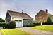 Garage with guest quarters and house in background