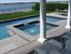 pool showing porch and dining area