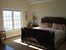 king sized master bed with vaulted ceilings