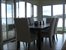 Dining area adjoining outdoor dining covered terrace at left