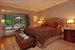 The master suite has a garden facing sunroom
