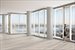 Soaring ceilings and floor-to-ceiling glass window walls
