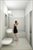 Secondary Bath with marble mosaic tile walls