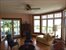 Waterside living room with bay window and fireplace