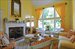 Dramatic, double height great room with fireplace