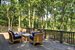 Expansive outdoor entertaining deck overlooking the pond