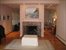 living room fireplace and sliders