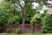 fenced yard with arbor