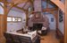 Living area with soaring fireplace