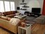LIVING ROOM WITH LARGE FLAT SCREEN TV