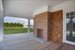 covered porch with fireplace